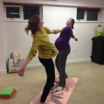 Partner poses in pregnancy yoga - modified Warrior 2. Birthlight Pregnancy yoga.